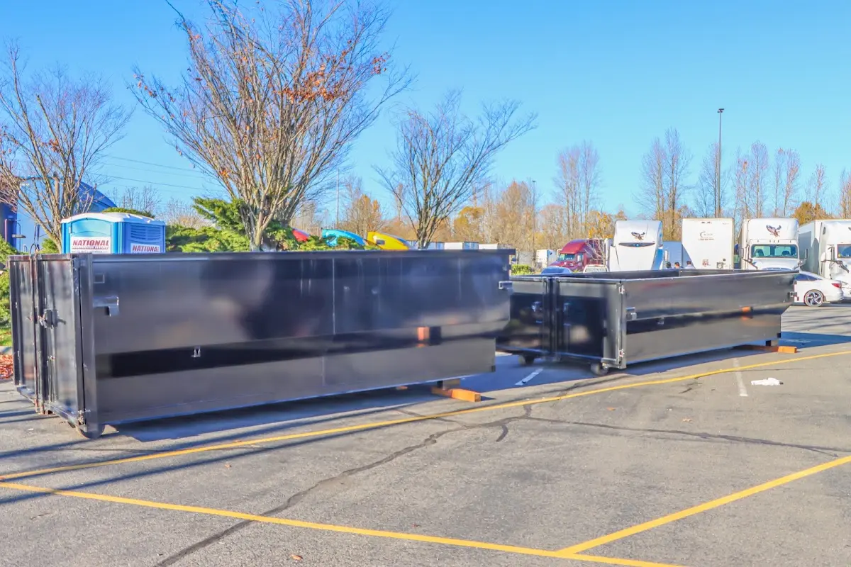 Professional dumpster rental service with roll-off container on residential driveway in Balch Springs